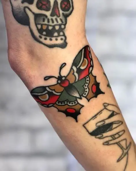 Skull and Butterfly Arm Tattoo