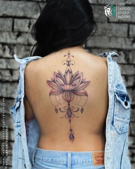 Colored Ornaments and Lotus Flower Spine Tattoo