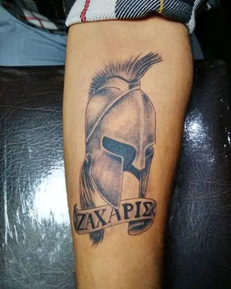 Black and Grey Greek Letters and Spartan Helmet Arm Tattoo