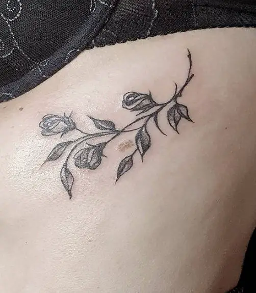 Rose Bud Branch and Leaves Ribs Tattoo