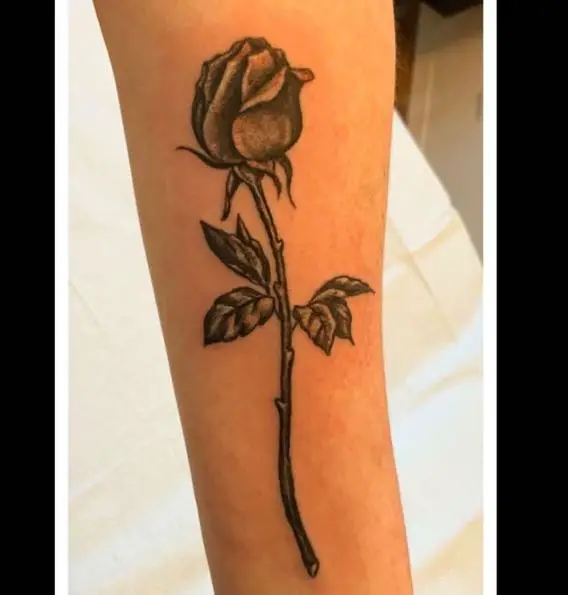 Black Shaded Rose Bud with Branch and Leaves Forearm Tattoo