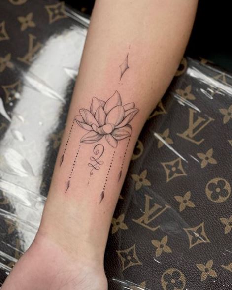 Grey Shaded Lotus Flower Wrist Tattoo