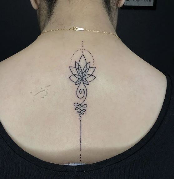 Black Lotus Flower Spine Tattoo