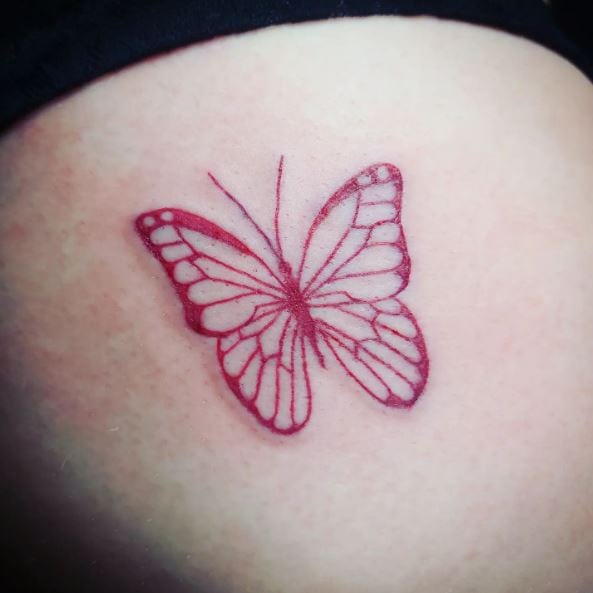 Red Ink Butterfly Thigh Tattoo