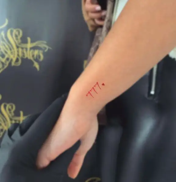 Red Hearth and 777 Wrist Tattoo
