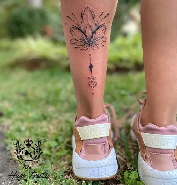 Grey Shaded Lotus Flower Calf Tattoo