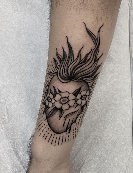 Flowers on Bleeding Sacred Heart Forearm Tattoo