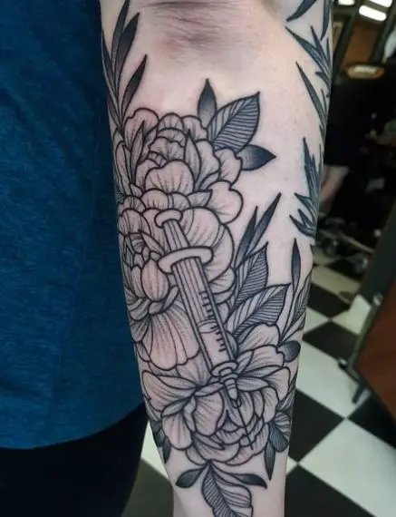 Syringe and Flowers Tattoo