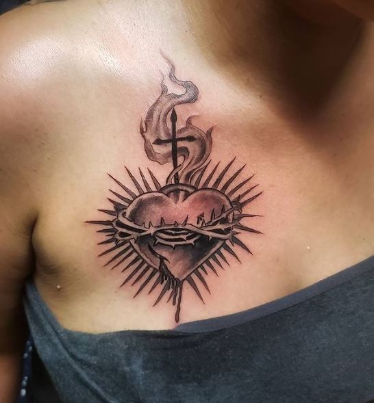 Black and Grey Bleeding Sacred Heart Chest Tattoo