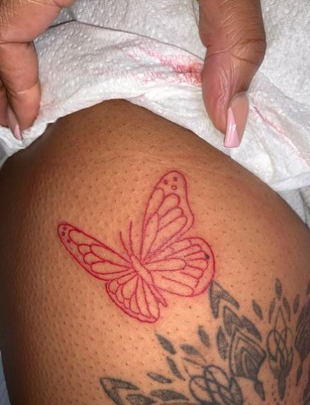 Big Red Butterfly Thigh Tattoo