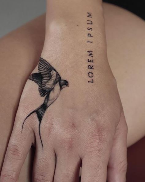 Latin Text with Black and White Realistic Swallow Hand Tattoo