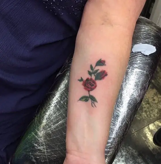 Three Small Red Roses on Forearm Tattoo