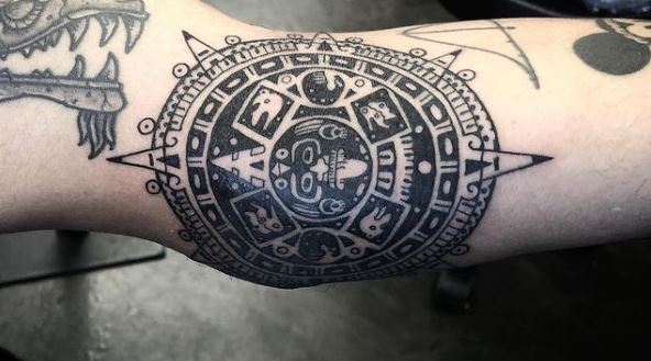 Grey Shaded Mayan Sun Elbow Tattoo