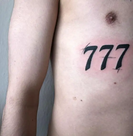 Black Bold 777 Chest Tattoo