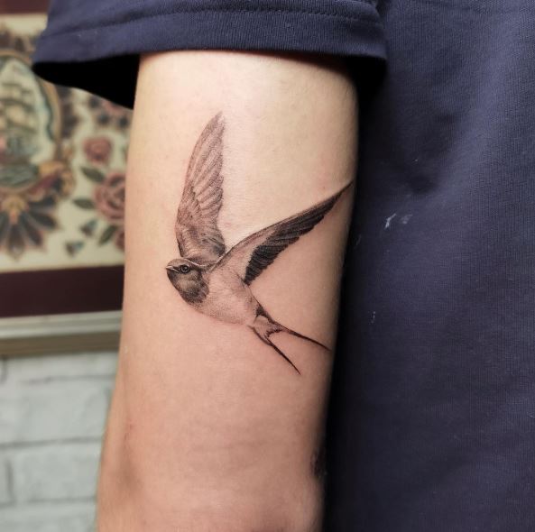 Small Grey Realistic Swallow Arm Tattoo