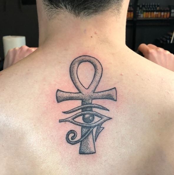 Ankh with Eye of Horus Spine Tattoo