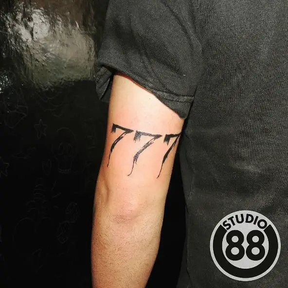 Black Inked 777 Arm Tattoo
