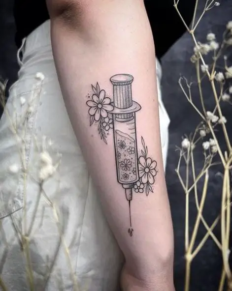 Grey Syringe and Flowers Tattoo