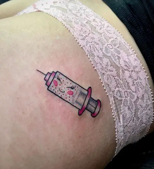 Pink Smiling Syringe Tattoo