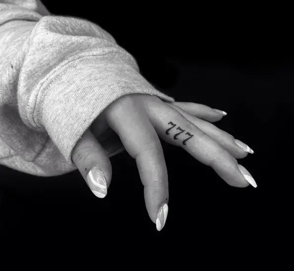Grey Minimalistic 777 Finger Tattoo
