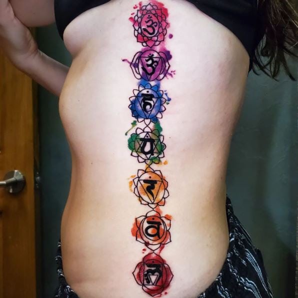 Colorful Chakra Symbols Ribs Tattoo