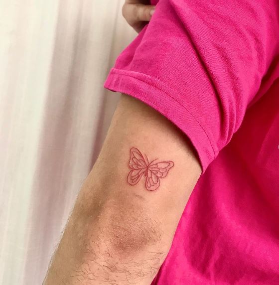 Small Red Butterfly Elbow Tattoo