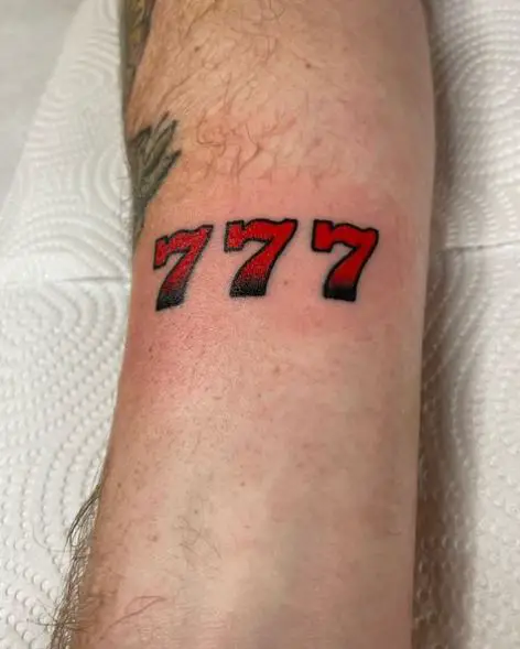 Black and Red 777 Arm Tattoo