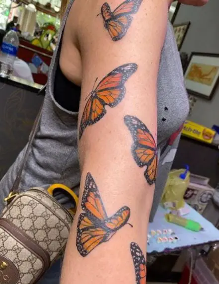 Colored Butterflies Arm Tattoo