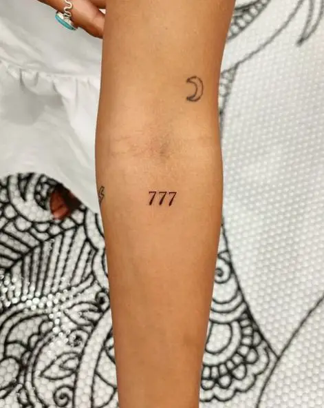 Half Moon and 777 Arm Tattoo