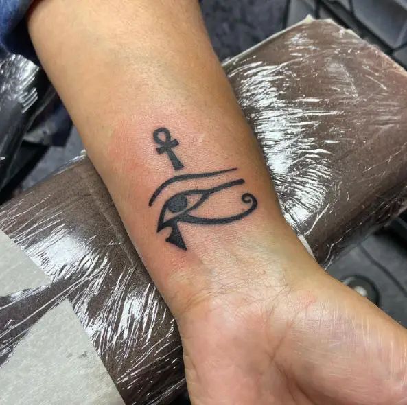 Minimalistic Ankh and Eye of Horus Wrist Tattoo