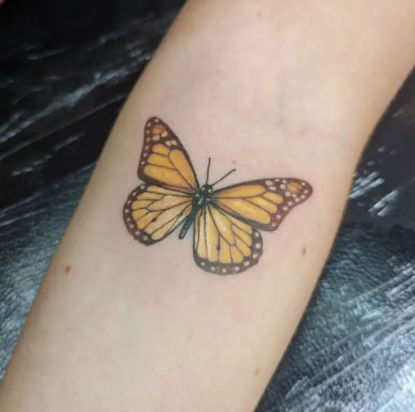 Small Monarch Butterfly Arm Tattoo