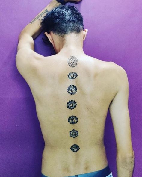 Black and Grey Chakra Symbols Spine Tattoo