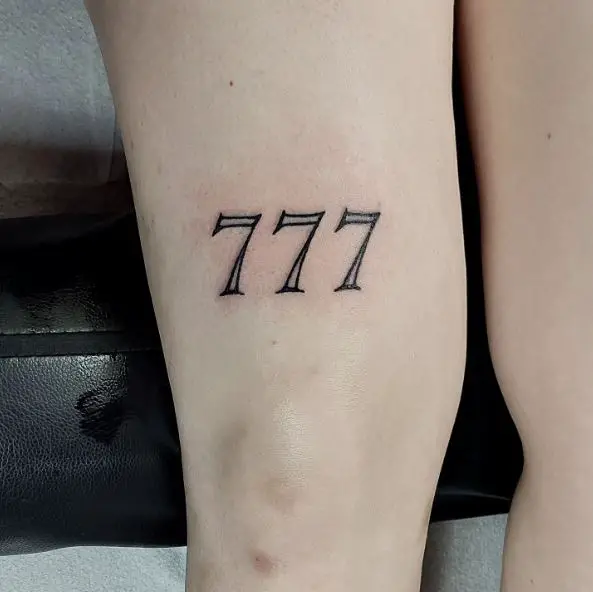 Black and White 777 Thigh Tattoo