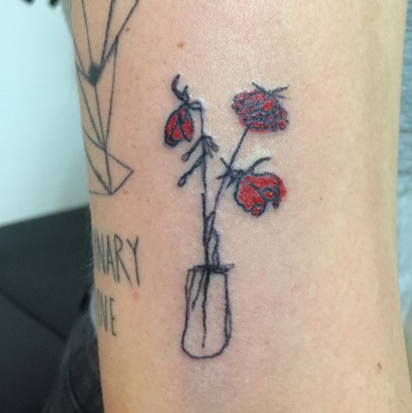 Three Dying Red Roses in Jar Tattoo