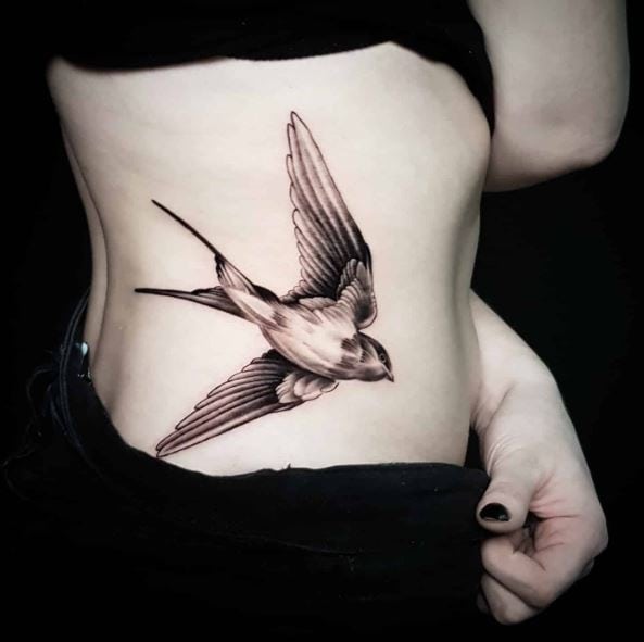 Black and Grey Flying Swallow Ribs Tattoo