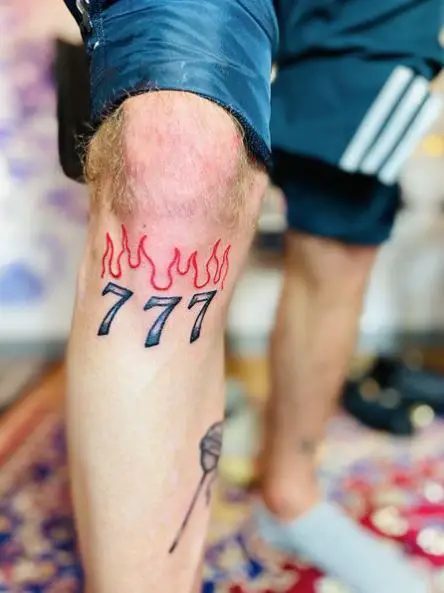 Colored Burning 777 Knee Tattoo