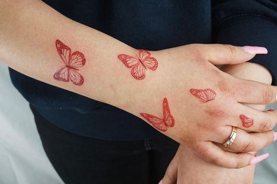 Red Monarch Butterflies Forearm and Hand Tattoo