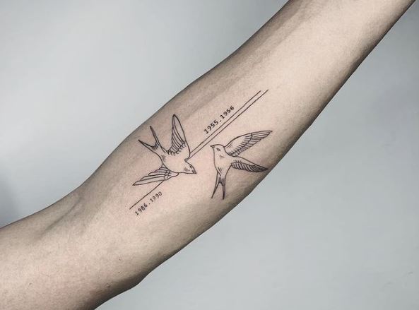 Fine-line Two Swallows Forearm Tattoo with Years