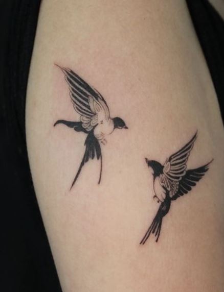 Black and White Two Swallows Playing Arm Tattoo