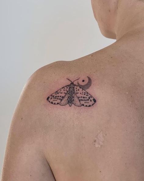 Half Moon and Small Moth Shoulder Tattoo