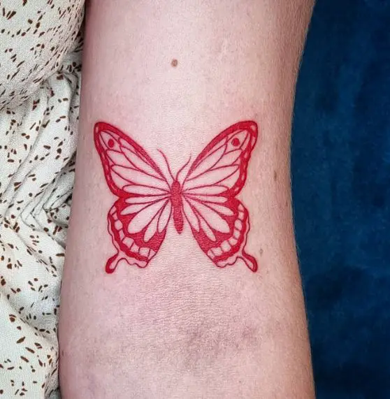 Bright Red Butterfly Biceps Tattoo