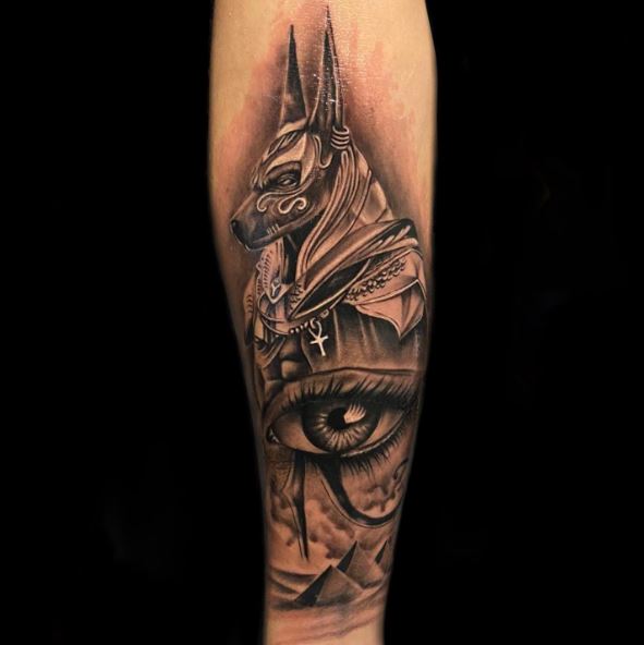 Realistic Dark Anubis and Eye of Horus Tattoo