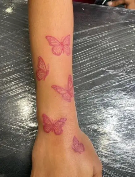 Group of Red Butterflies Forearm Tattoo