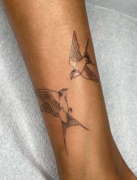 Fine-Lined Two Flying Swallows Leg Tattoo