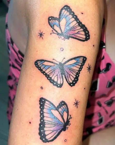 Colored Flying Butterflies Arm Tattoo