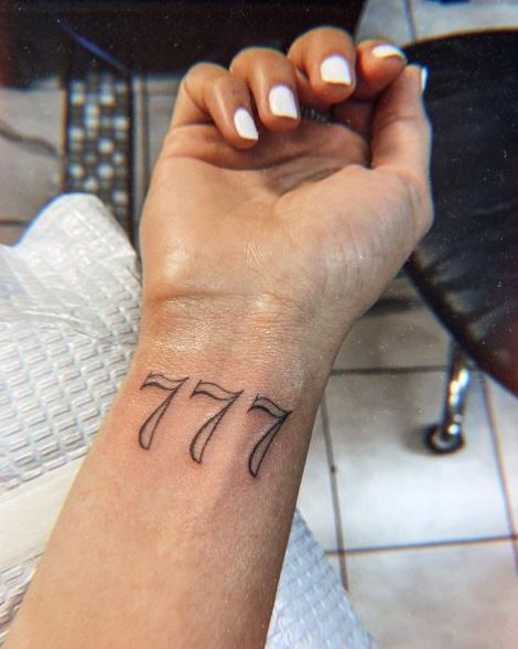 Grey 777 Wrist Tattoo