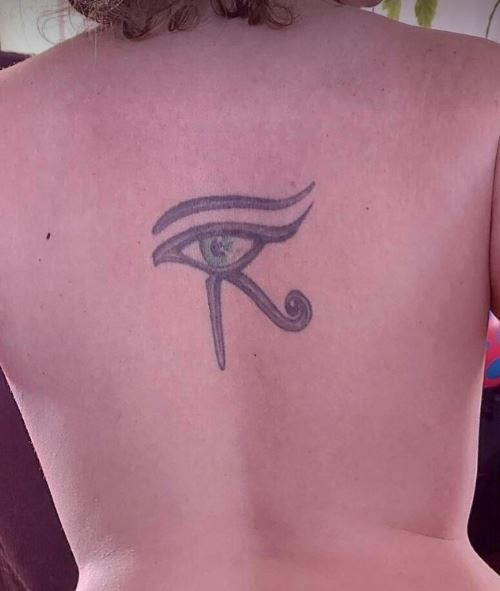 Artistic Eye of Horus Spine Tattoo