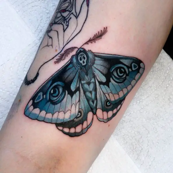 Blue and Black Moth Arm Tattoo