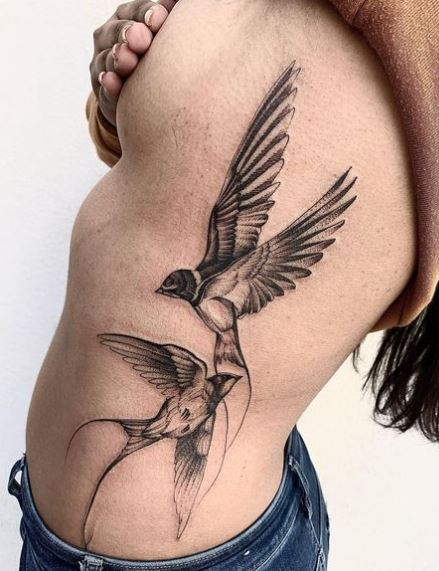 Big Black Two Swallows Ribs Tattoo