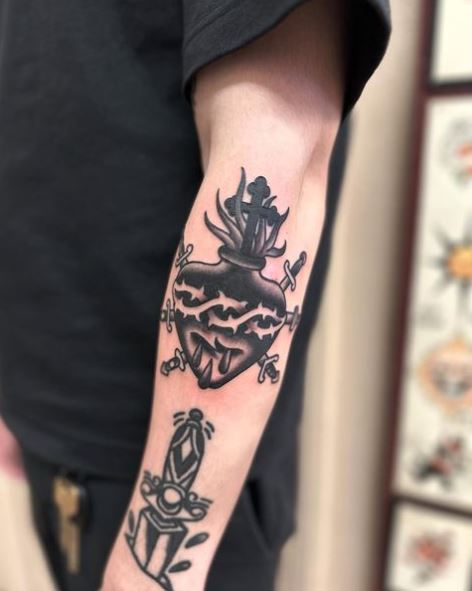 Black Stabbed Sacred Heart Elbow Tattoo